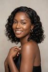 Deep wave short bob wig worn on a model with neutral background